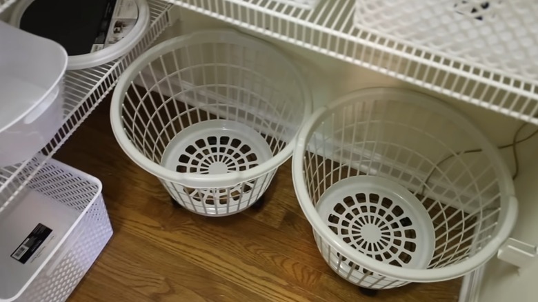 Rolling storage basket in kitchen pantry