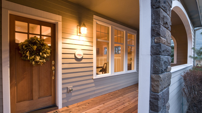Warm light shining near the front door illuminating the front porch