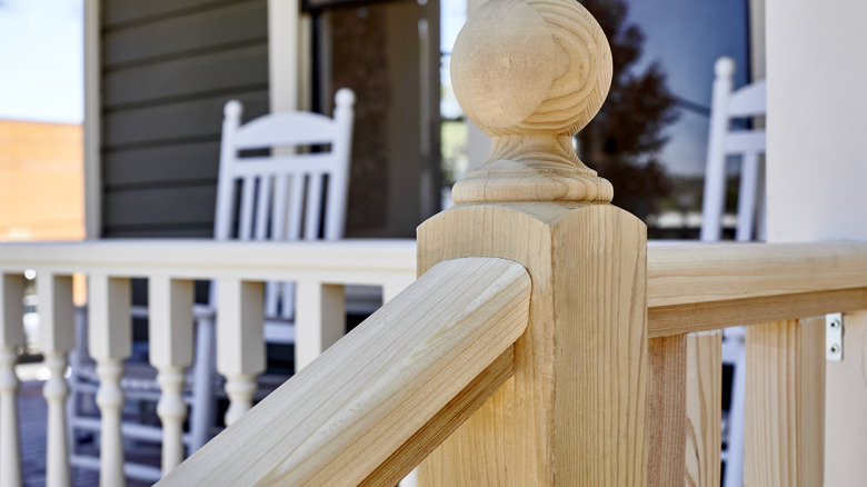 New wood railing on front porch stairs