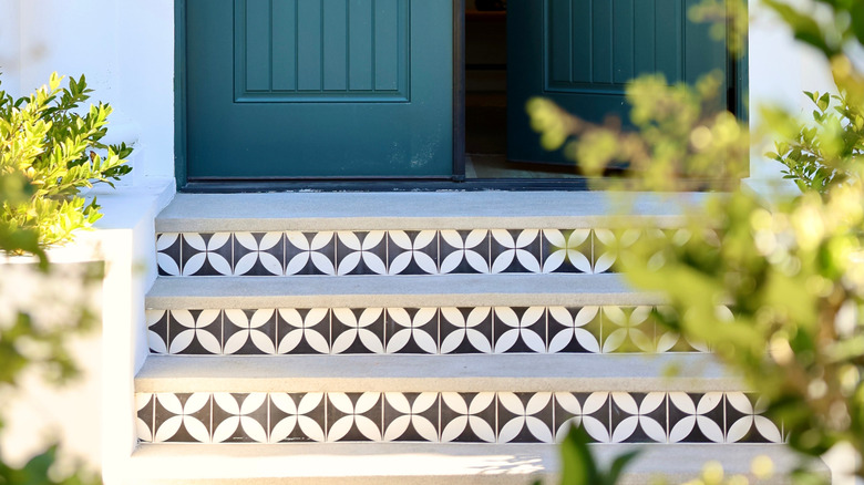 Person taking stack of tiles out of a box
