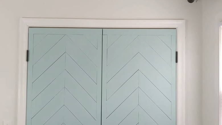 light blue "planks" cut from thin hardboard and glued to a closet door