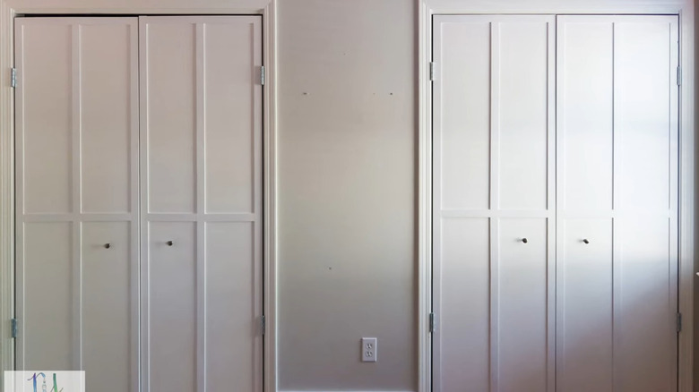 white center swing doors with trim and minimalistic knobs