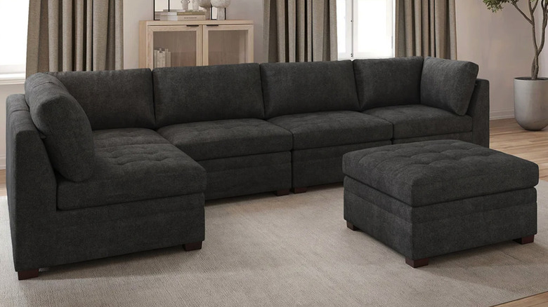 Thomasville sectional with an ottoman in a modern livingroom with natural light