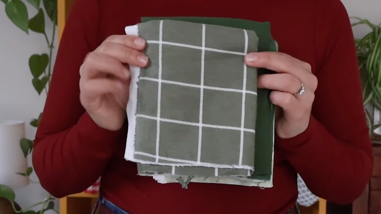 Person holding cut pieces of fabric to use as hand towels