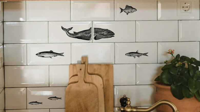 A whale decor tattoo on a kitchen's backsplash