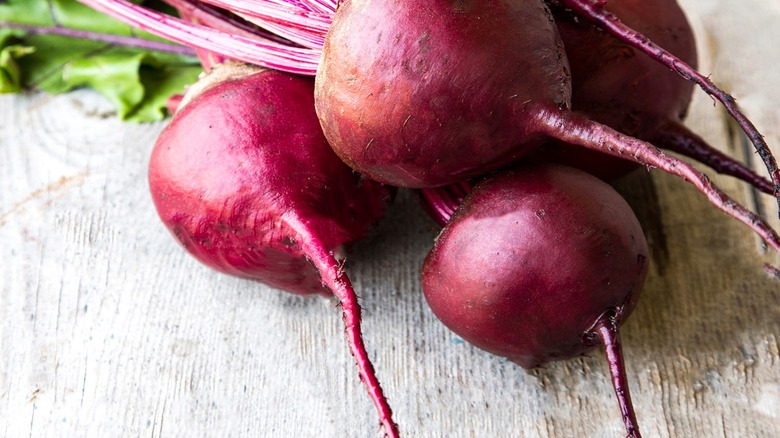 Fresh purple beets with green leaves