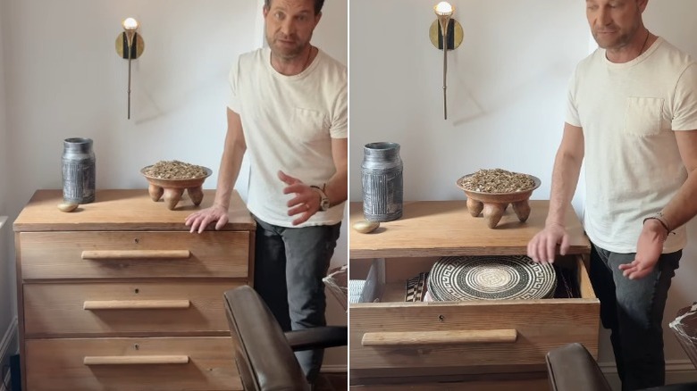A chest of three raw wood drawers.