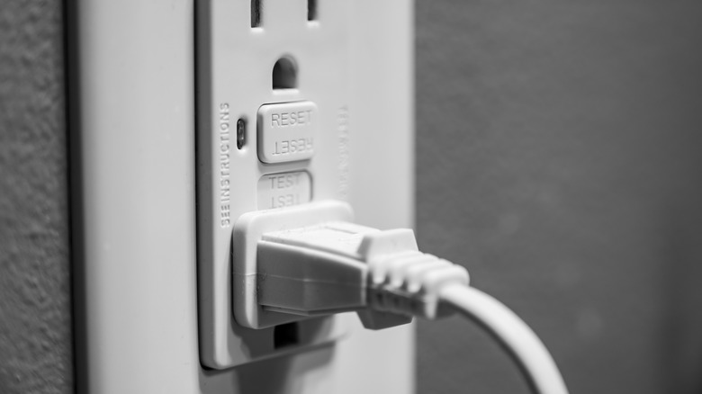 Covered GFCI electrical outlet