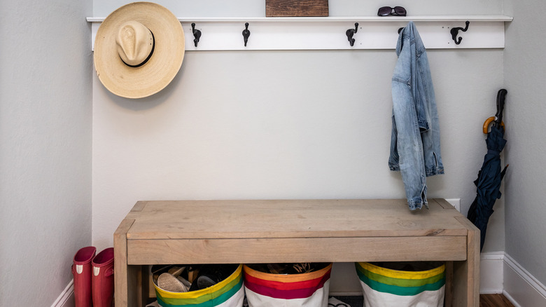 Storage bench and hooks in small nook of garage