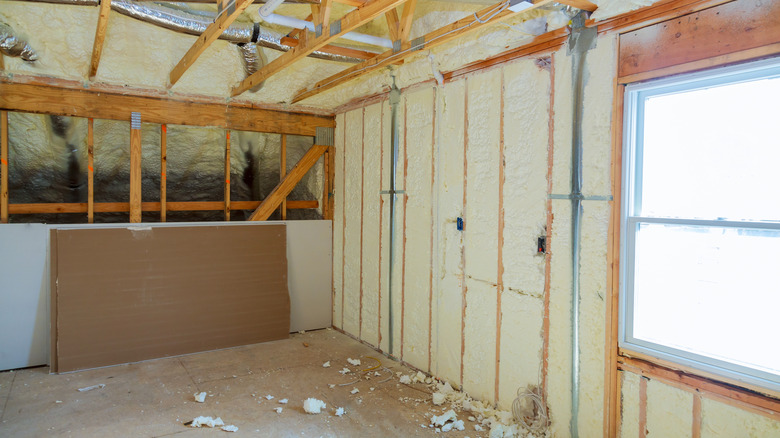 Foam insulation installation in garage before drywall is added