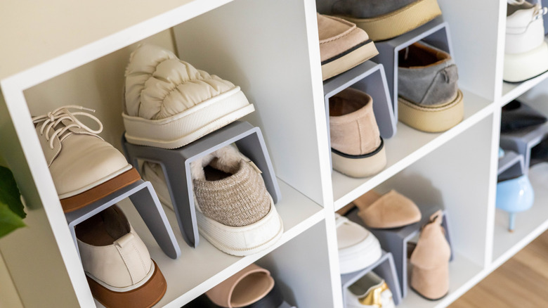 Pairs of shoes on open shelving