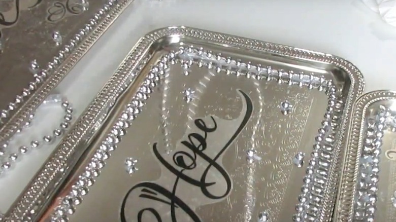silver sign with words