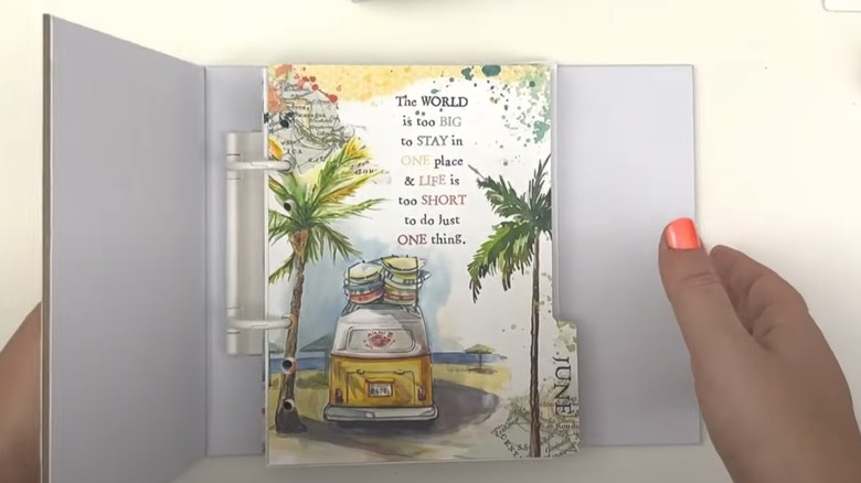 someone holding planner opened to June