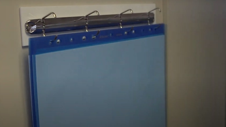 binder ring magnet holding blue sheet protectors