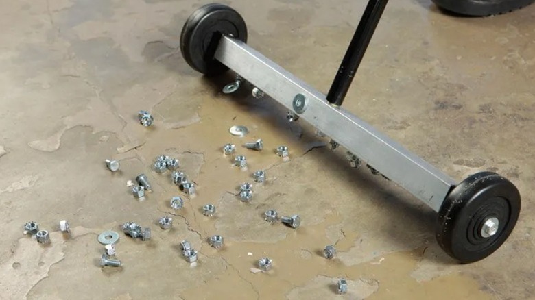 magnetic sweeper picking up bolts and screws off floor