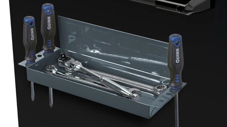 magnetic tray secured to side of work bench with screwdrivers and wrenches
