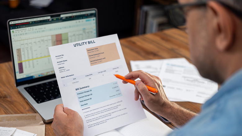 Man reviewing his energy bill