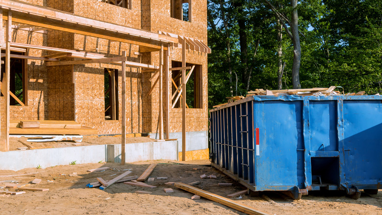 Dumpster outside home under construction
