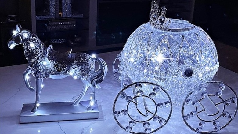 A finished DIY project using plastic punch bowls to create a toy carriage