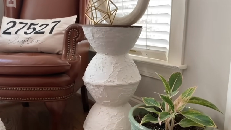 A side table made from plastic punch bowls