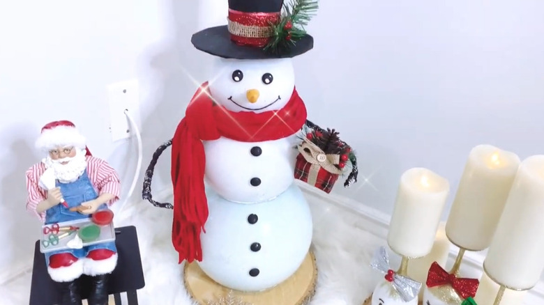 A DIY snowman decor made from plastic fish bowls