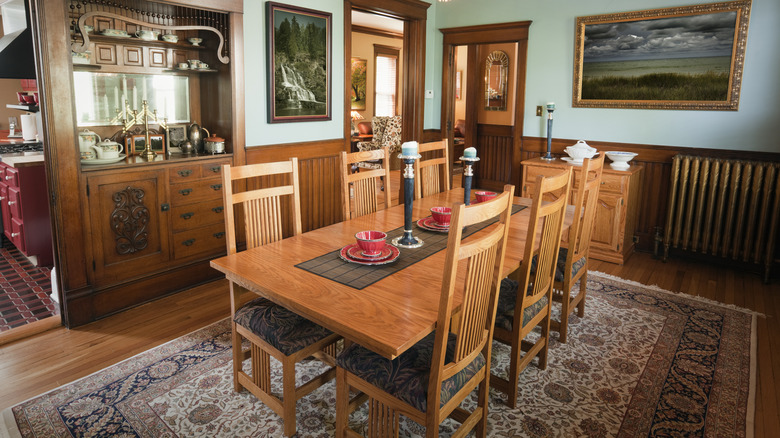 A dining room elevated with a Persian rug