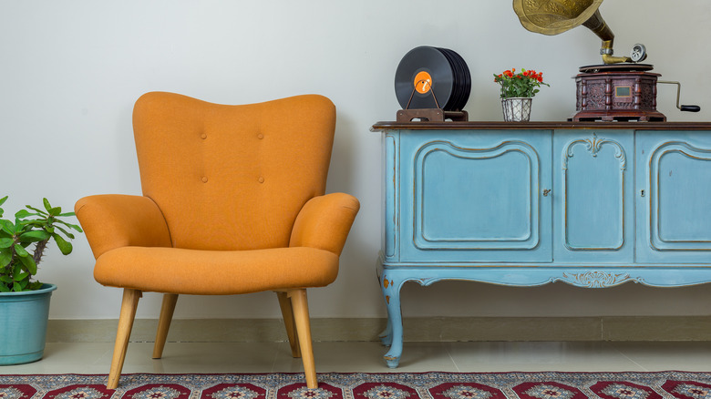 Yellow accent chair next to la sky blue accent table