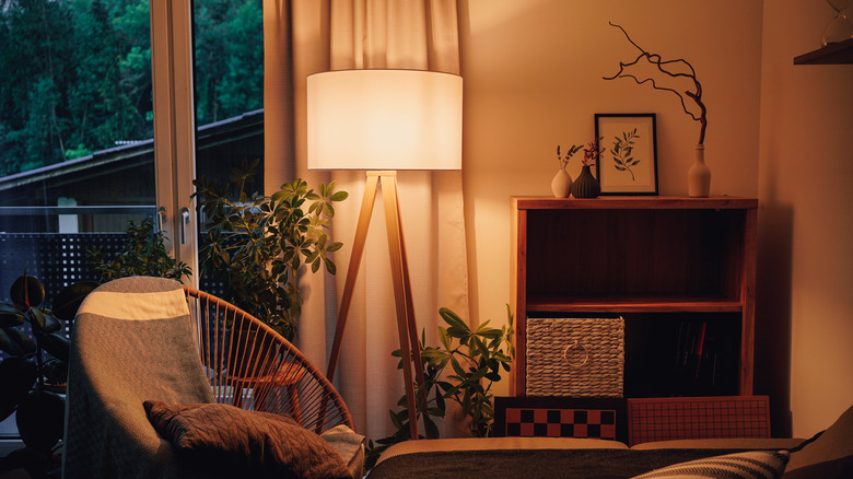 Cozy living room lit with warm light from a lamp