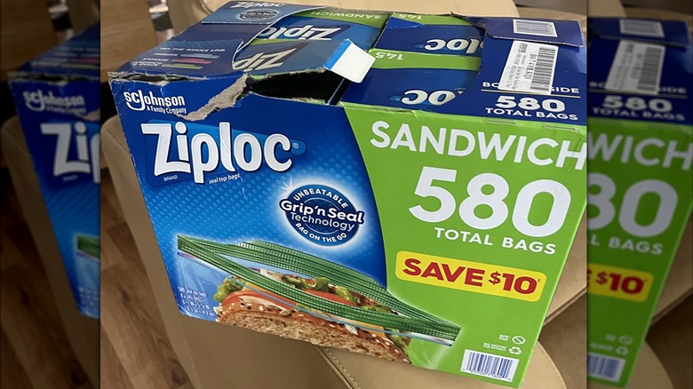 Bulk box of Ziploc sandwich bags on tan couch