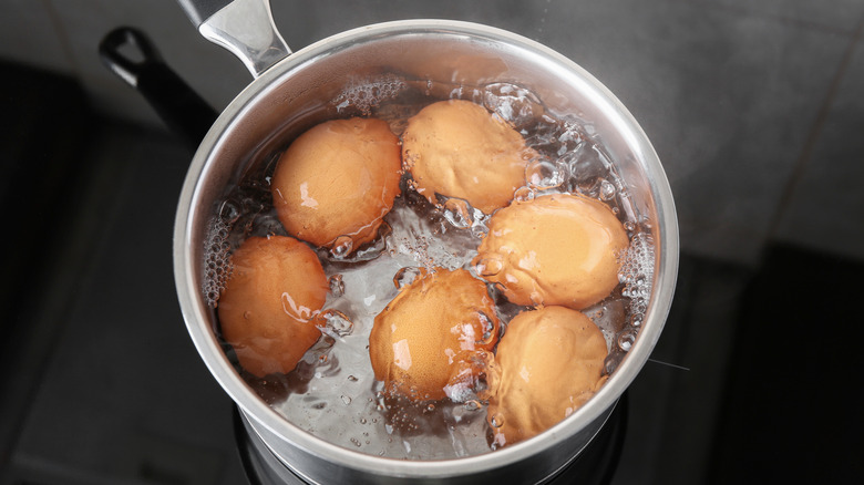 Eggs boiling in pot