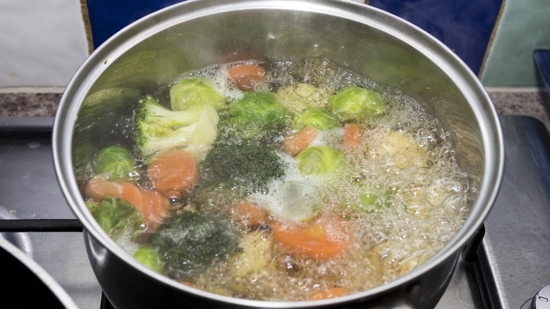 Vegetables boiling in pot