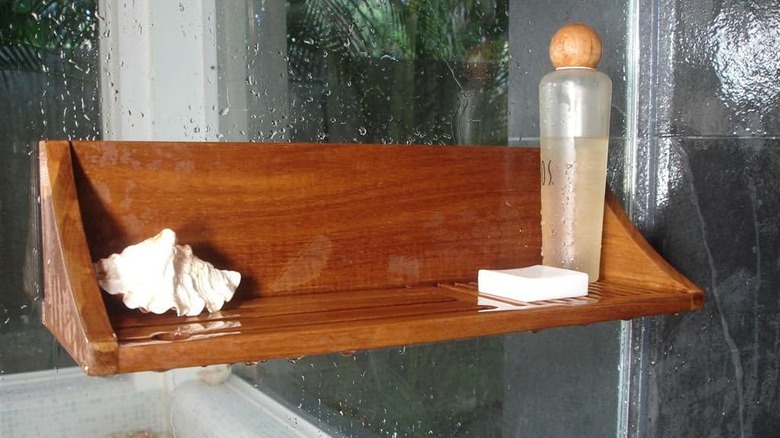 a shelf mounted in the shower