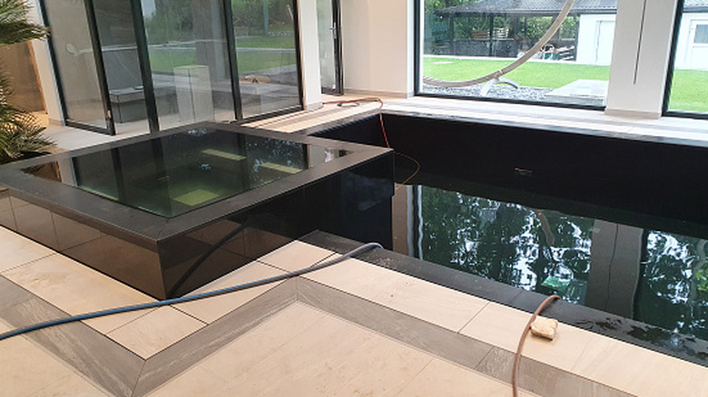Dark tiled indoor pool