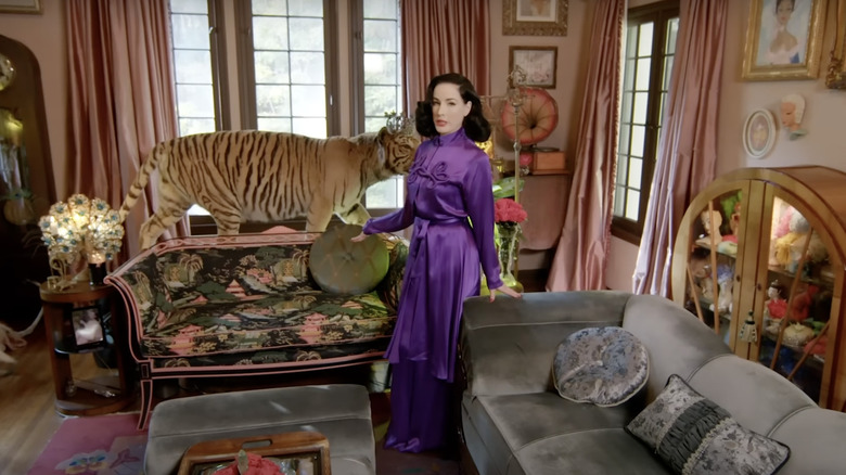 celebrity in bizarre antique living room