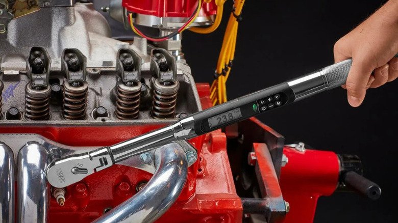 Icon's new digital torque wrench in use on an engine