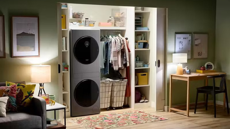 The Whirlpool Compact Laundry Tower in a laundry closet open to a living space