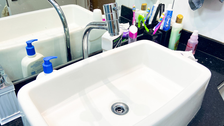 Bathroom counter with toiletries on it