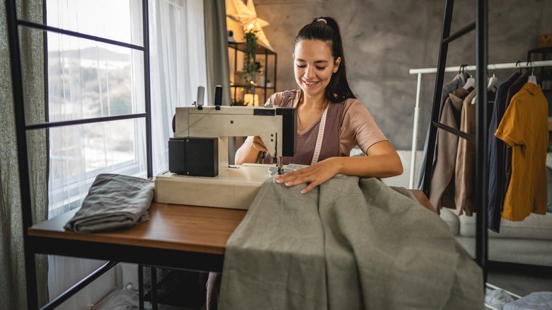 Woman using a modern sewing machine