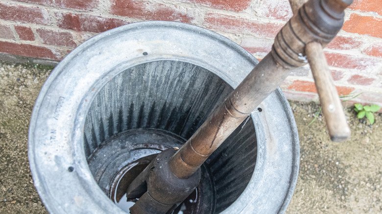 washing dolly inside a metal washing tub