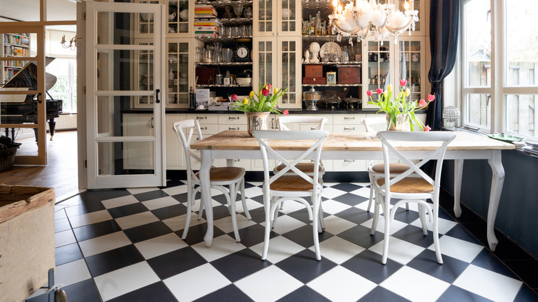 Black and white checkerboard tile floors in vintage kitchen
