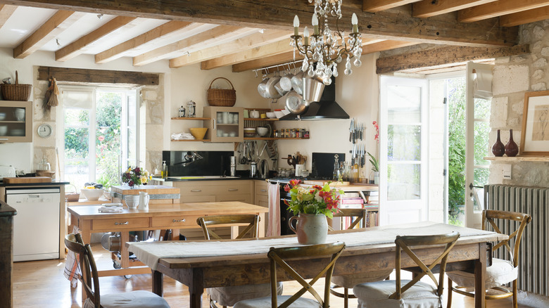 rustic farmhouse kitchen with wood ceiling beams and wood furniture