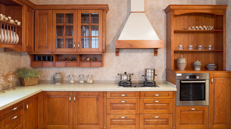 kitchen with warm wood raised panel cabinet doors
