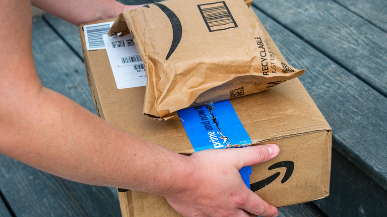 Person picking up Amazon packages