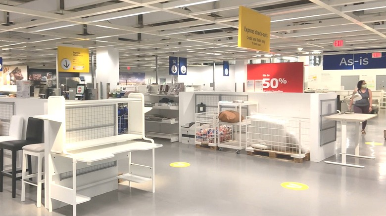 Chairs, home decor, and other items in as-is section of an IKEA store