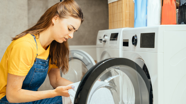 person frustrated doing laundry