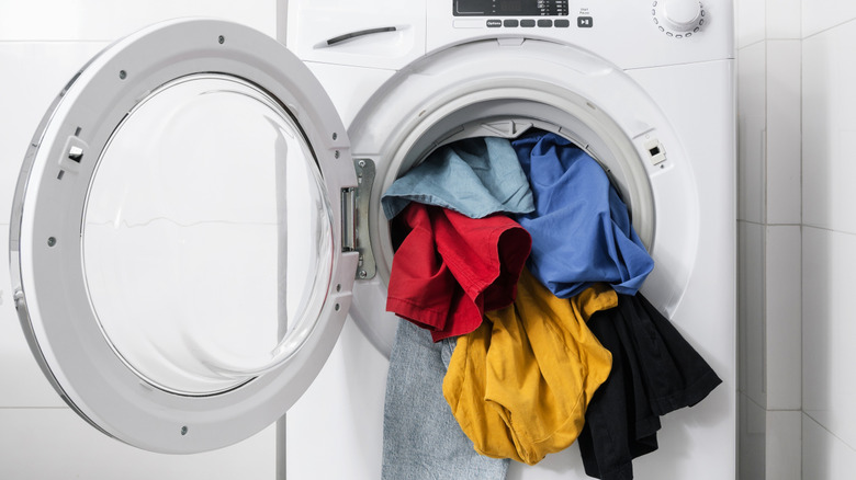 clothes overflowing from washer