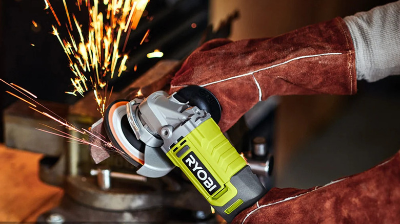 Close-up of a person working with Ryobi's 18V One+ Cordless 4-½-inch Angle Grinder