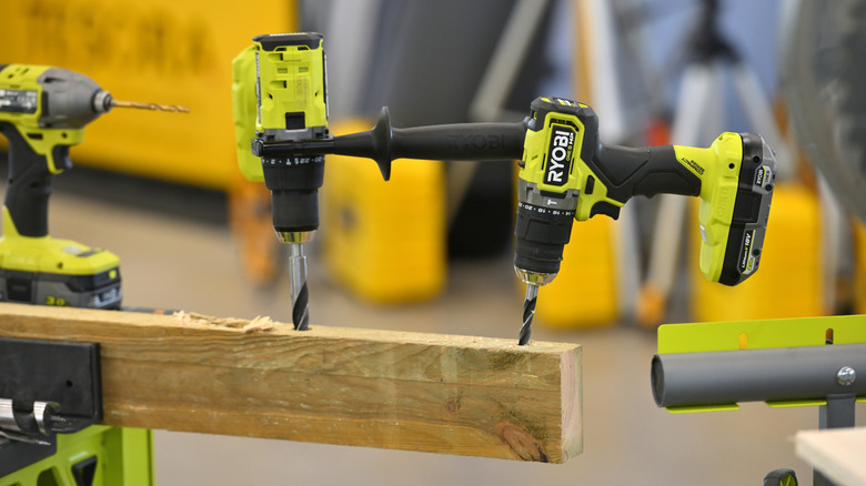 Ryobi power tools in piece of wood