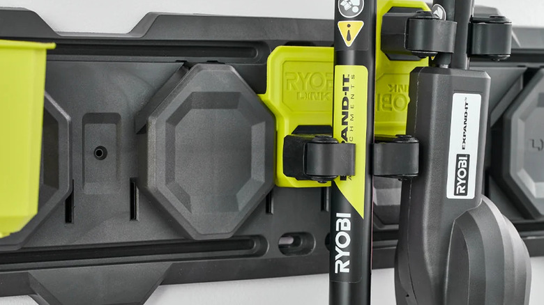Close-up of tools hanging from Ryobi's LINK Reversible Clamp Hooks