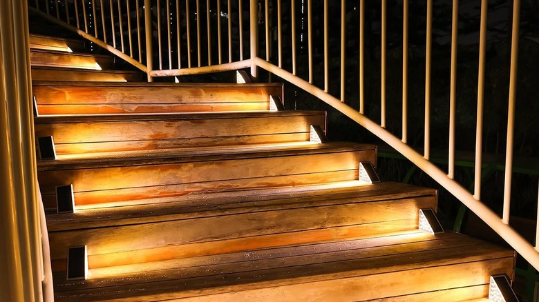 Wooden outdoor steps illuminated by Volisun's Solar Stair Lights